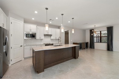 Over $150,000 in upgrades and custom additions make this 2023 on River Hall Country Club in Florida - for sale on GolfHomes.com, golf home, golf lot