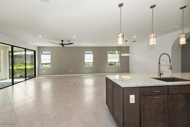 Over $150,000 in upgrades and custom additions make this 2023 on River Hall Country Club in Florida - for sale on GolfHomes.com, golf home, golf lot