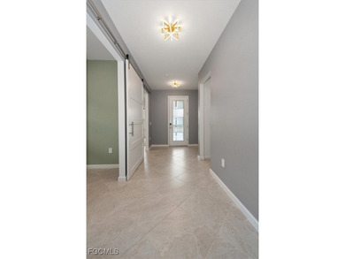 Over $150,000 in upgrades and custom additions make this 2023 on River Hall Country Club in Florida - for sale on GolfHomes.com, golf home, golf lot