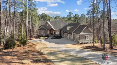 Discover the epitome of luxury living in this exquisite estate on Reynolds Lake Oconee - The Oconee in Georgia - for sale on GolfHomes.com, golf home, golf lot
