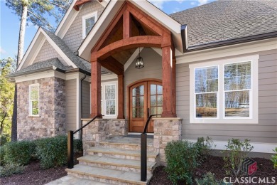 Discover the epitome of luxury living in this exquisite estate on Reynolds Lake Oconee - The Oconee in Georgia - for sale on GolfHomes.com, golf home, golf lot