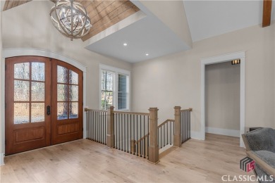 Discover the epitome of luxury living in this exquisite estate on Reynolds Lake Oconee - The Oconee in Georgia - for sale on GolfHomes.com, golf home, golf lot