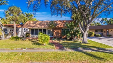 This property in the highly sought-after Hollywood Lakes is an on Hollywood Beach Golf and Country Club in Florida - for sale on GolfHomes.com, golf home, golf lot