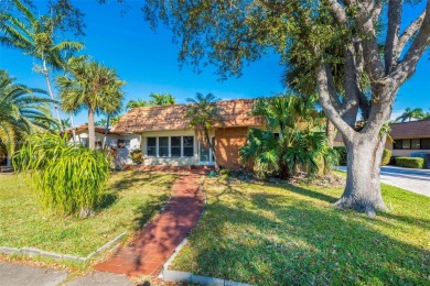 This property in the highly sought-after Hollywood Lakes is an on Hollywood Beach Golf and Country Club in Florida - for sale on GolfHomes.com, golf home, golf lot