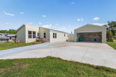 PERFECT HOME FOR YOU AND YOUR TOYS AND X FLOOD ZONE! Located on on Blue Heron Pines Golf Course in Florida - for sale on GolfHomes.com, golf home, golf lot