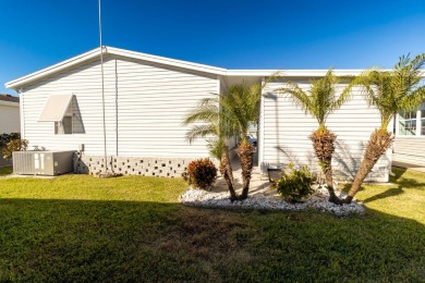 Welcome to this charming 2-bedroom, 2-bathroom manufactured home on Lily Lake Golf and RV Resort in Florida - for sale on GolfHomes.com, golf home, golf lot