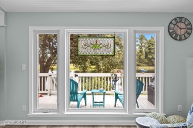 Enjoy captivating water views from nearly every room in this on Harbour Point Golf Club in North Carolina - for sale on GolfHomes.com, golf home, golf lot