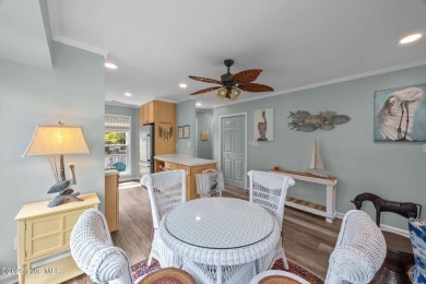 Enjoy captivating water views from nearly every room in this on Harbour Point Golf Club in North Carolina - for sale on GolfHomes.com, golf home, golf lot