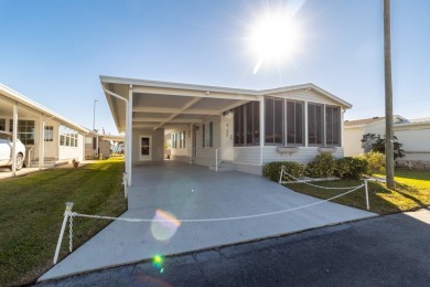 Welcome to this charming 2-bedroom, 2-bathroom manufactured home on Lily Lake Golf and RV Resort in Florida - for sale on GolfHomes.com, golf home, golf lot