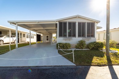 Welcome to this charming 2-bedroom, 2-bathroom manufactured home on Lily Lake Golf and RV Resort in Florida - for sale on GolfHomes.com, golf home, golf lot