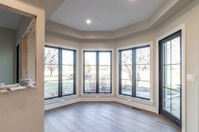 Welcome to this elegant 4-bedroom, 4.2-bath home, situated on a on Royal Melbourne in Illinois - for sale on GolfHomes.com, golf home, golf lot
