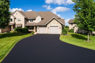 Crafted by Lowell Custom Homes this Geneva National townhome on Geneva National Golf Club in Wisconsin - for sale on GolfHomes.com, golf home, golf lot