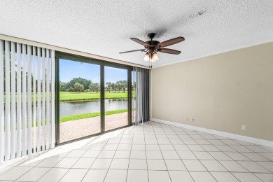 Enjoy stunning lake and golf course views from this beautifully on Fountains Golf and Country Club in Florida - for sale on GolfHomes.com, golf home, golf lot