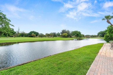 Enjoy stunning lake and golf course views from this beautifully on Fountains Golf and Country Club in Florida - for sale on GolfHomes.com, golf home, golf lot