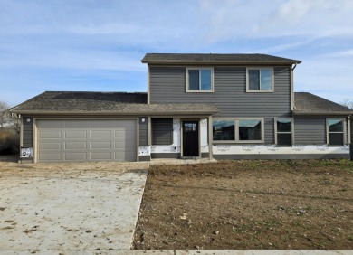 Brand new construction. Located in Hidden Bridge Ranch across on Hidden Bridge Golf Club in Wyoming - for sale on GolfHomes.com, golf home, golf lot