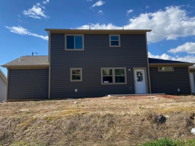 Brand new construction. Located in Hidden Bridge Ranch across on Hidden Bridge Golf Club in Wyoming - for sale on GolfHomes.com, golf home, golf lot