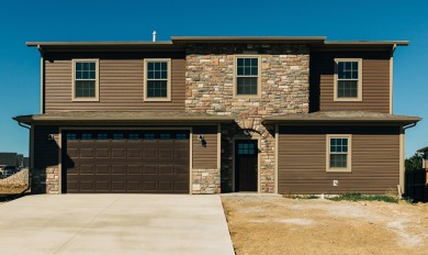 Brand new construction. Located in Hidden Bridge Ranch across on Hidden Bridge Golf Club in Wyoming - for sale on GolfHomes.com, golf home, golf lot