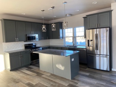 Brand new construction. Located in Hidden Bridge Ranch across on Hidden Bridge Golf Club in Wyoming - for sale on GolfHomes.com, golf home, golf lot