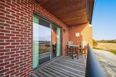 Experience premier coastal living in this elevator-accessible on Bay Creek Golf Club in Virginia - for sale on GolfHomes.com, golf home, golf lot