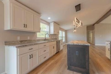 This beautifully remodeled 3-bedroom, 2-bathroom home is on Kings River Golf Course in Missouri - for sale on GolfHomes.com, golf home, golf lot