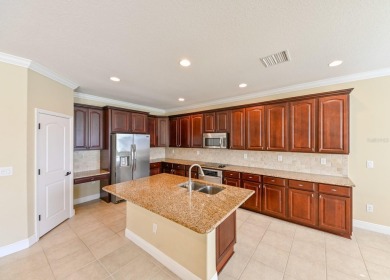 This spacious 4 bedroom, 3.5 bathroom, 3 car garage, 2 story on Heritage Harbor Golf and Country Club in Florida - for sale on GolfHomes.com, golf home, golf lot