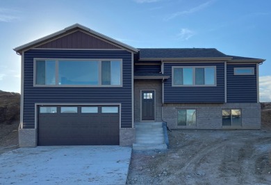 Brand new construction. Located in Hidden Bridge Ranch across on Hidden Bridge Golf Club in Wyoming - for sale on GolfHomes.com, golf home, golf lot