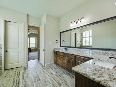 Embrace luxury living in this custom Oakdale home in the golf on The Bridges Golf Club in Texas - for sale on GolfHomes.com, golf home, golf lot