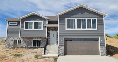 Brand new construction. Located in Hidden Bridge Ranch across on Hidden Bridge Golf Club in Wyoming - for sale on GolfHomes.com, golf home, golf lot