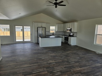 Brand new construction. Located in Hidden Bridge Ranch across on Hidden Bridge Golf Club in Wyoming - for sale on GolfHomes.com, golf home, golf lot