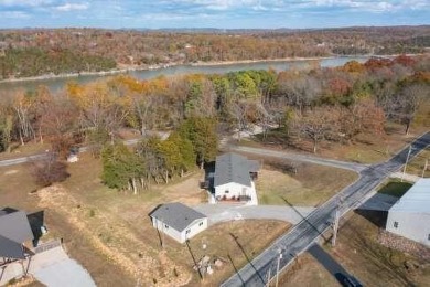 This beautifully remodeled 3-bedroom, 2-bathroom home is on Kings River Golf Course in Missouri - for sale on GolfHomes.com, golf home, golf lot