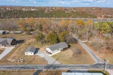 This beautifully remodeled 3-bedroom, 2-bathroom home is on Kings River Golf Course in Missouri - for sale on GolfHomes.com, golf home, golf lot