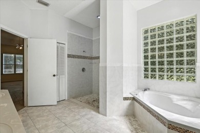 Spectacular concrete block pool home tucked at the end of a on The Grand Club - Pine Lakes Course in Florida - for sale on GolfHomes.com, golf home, golf lot