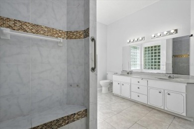 Spectacular concrete block pool home tucked at the end of a on The Grand Club - Pine Lakes Course in Florida - for sale on GolfHomes.com, golf home, golf lot