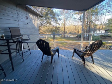Canal front Coastal Home. Remodeled in 2023. 2 story modern on Mississippi National Golf Course in Mississippi - for sale on GolfHomes.com, golf home, golf lot