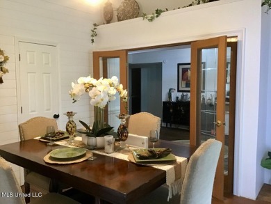 Canal front Coastal Home. Remodeled in 2023. 2 story modern on Mississippi National Golf Course in Mississippi - for sale on GolfHomes.com, golf home, golf lot