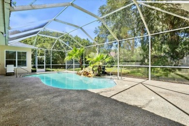 Spectacular concrete block pool home tucked at the end of a on The Grand Club - Pine Lakes Course in Florida - for sale on GolfHomes.com, golf home, golf lot