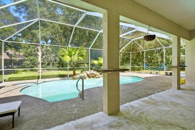 Spectacular concrete block pool home tucked at the end of a on The Grand Club - Pine Lakes Course in Florida - for sale on GolfHomes.com, golf home, golf lot