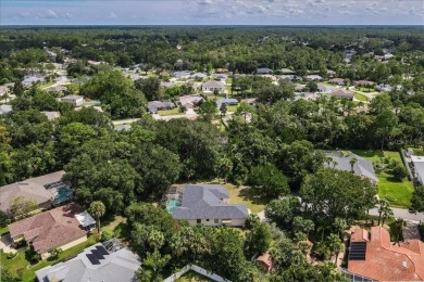 Spectacular concrete block pool home tucked at the end of a on The Grand Club - Pine Lakes Course in Florida - for sale on GolfHomes.com, golf home, golf lot
