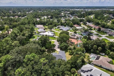 Spectacular concrete block pool home tucked at the end of a on The Grand Club - Pine Lakes Course in Florida - for sale on GolfHomes.com, golf home, golf lot