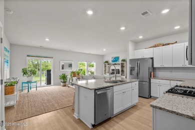 Welcome to this impeccably maintained 3-bedroom, 2-bathroom home on Ocean Ridge Plantation in North Carolina - for sale on GolfHomes.com, golf home, golf lot