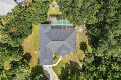 Spectacular concrete block pool home tucked at the end of a on The Grand Club - Pine Lakes Course in Florida - for sale on GolfHomes.com, golf home, golf lot