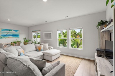 Welcome to this impeccably maintained 3-bedroom, 2-bathroom home on Ocean Ridge Plantation in North Carolina - for sale on GolfHomes.com, golf home, golf lot