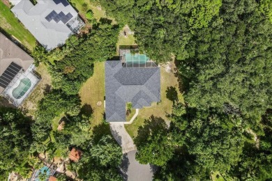 Spectacular concrete block pool home tucked at the end of a on The Grand Club - Pine Lakes Course in Florida - for sale on GolfHomes.com, golf home, golf lot