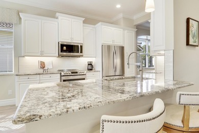 BEAUTIFULLY UPDATED POOL & SPA HOME IN PGA VILLAGE WITH LAKE on PGA Golf Club in PGA Village in Florida - for sale on GolfHomes.com, golf home, golf lot