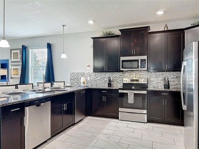Exceptional vacation home, incredible value! Turnkey and fully on The Oasis Club at Champions Gate in Florida - for sale on GolfHomes.com, golf home, golf lot