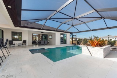 Modern Gulf Access Pool Home overlooking a wide canal near the 7 on Burnt Store Golf Club in Florida - for sale on GolfHomes.com, golf home, golf lot