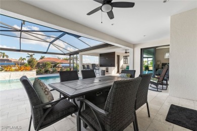 Modern Gulf Access Pool Home overlooking a wide canal near the 7 on Burnt Store Golf Club in Florida - for sale on GolfHomes.com, golf home, golf lot