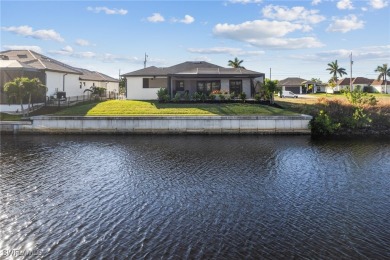 Modern Gulf Access Pool Home overlooking a wide canal near the 7 on Burnt Store Golf Club in Florida - for sale on GolfHomes.com, golf home, golf lot