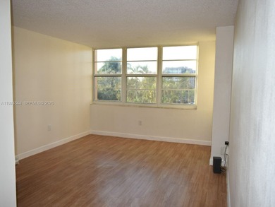 Discover comfort and convenience in this bright 2-bedroom condo on Pembroke Lakes Golf Club in Florida - for sale on GolfHomes.com, golf home, golf lot