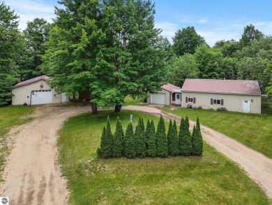 Nestled in an idyllic setting, this Barndominium home boasts on Lakes of the North Deer Run Golf Course in Michigan - for sale on GolfHomes.com, golf home, golf lot